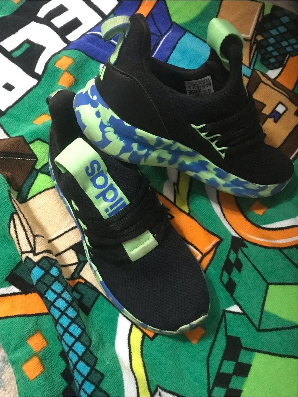 Adidas Kids Black Sneakers with Neon Green and Blue Patterned Sole